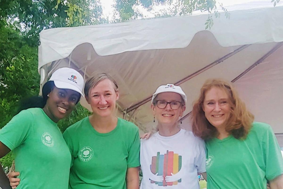 Christian with four other women, all wearing volunteer t-shirts