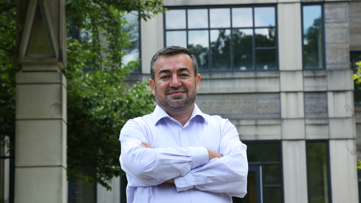 Abdullah Antepli standing outside Sanford building