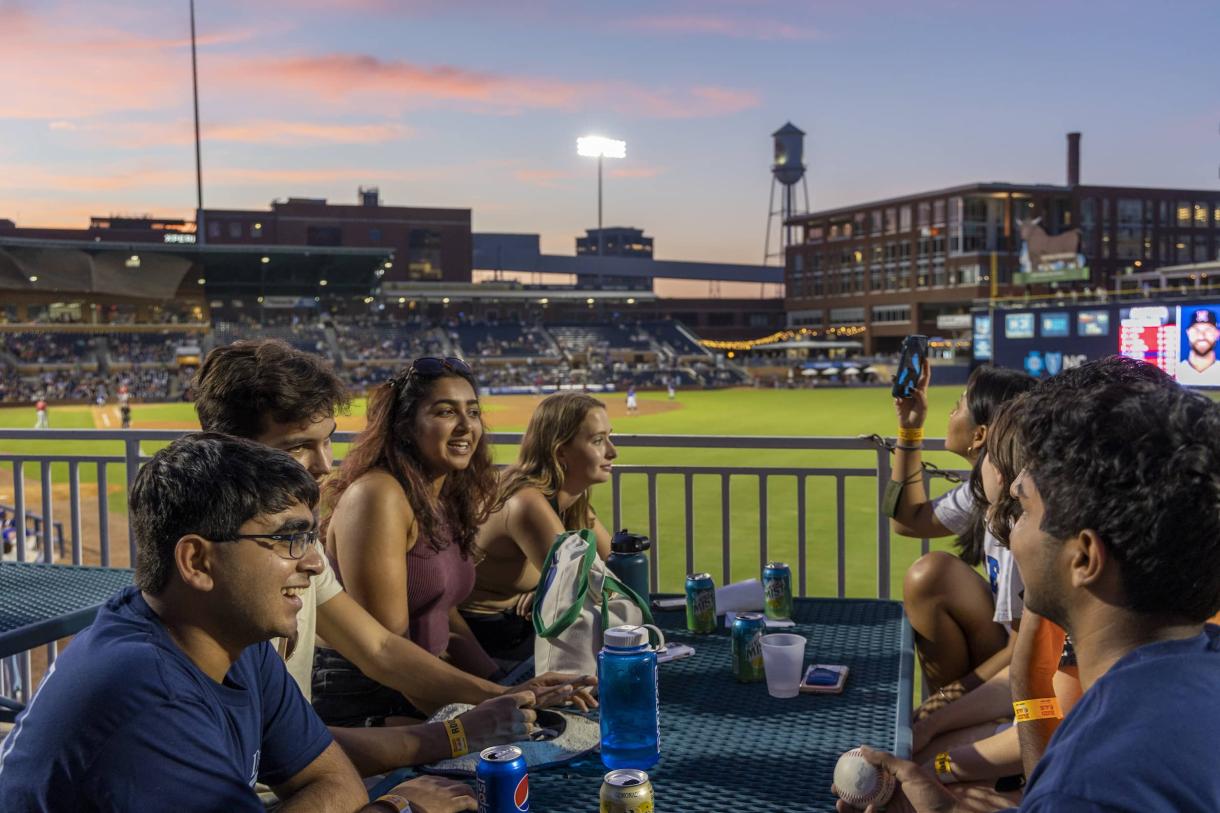 Students at Durham Bulls ballpark, twilight