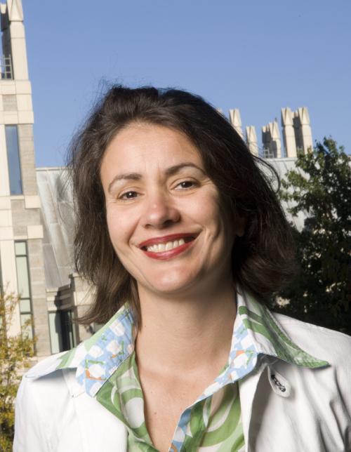 Woman smiling in front of the Sanford Building