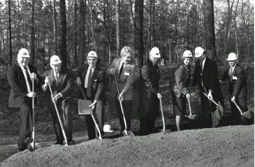 Variety of people with shovels breaking ground