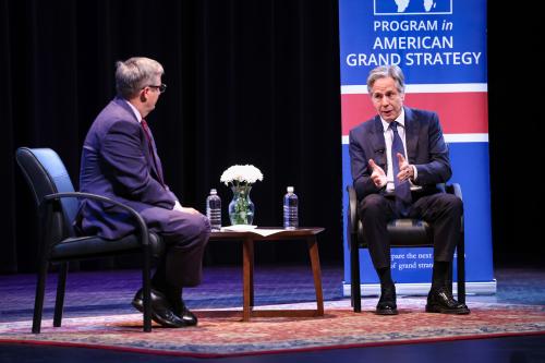Two men talking while on stage together