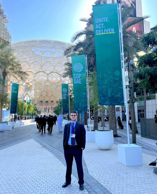 Man standing at COP28 outdoor plaza