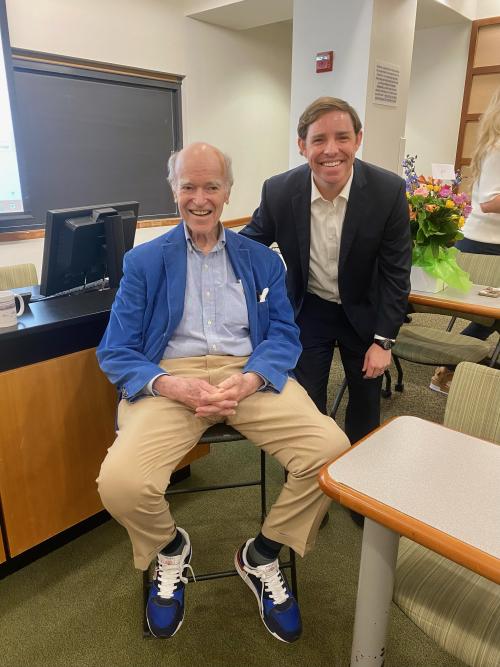 Two men smiling for photo