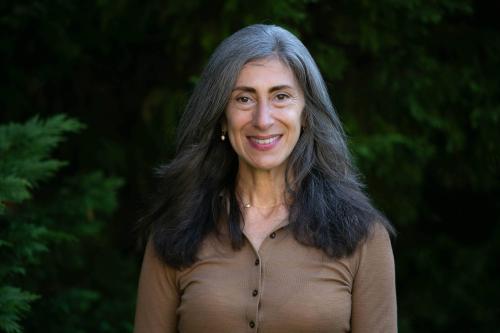 Woman with long hair, smiling