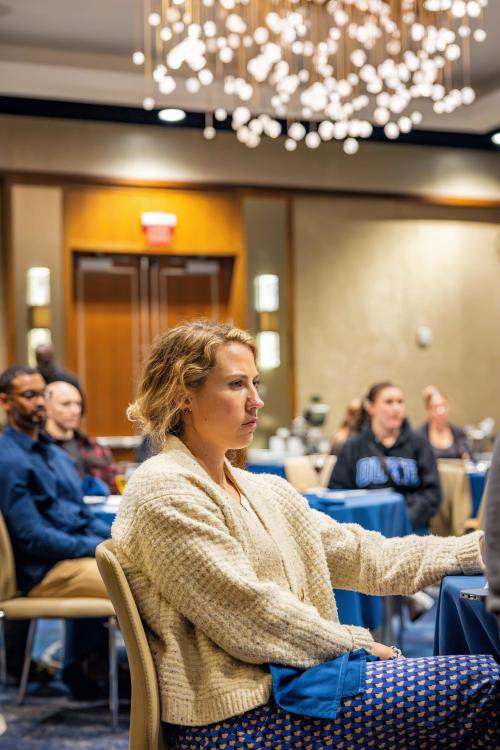 Female student watching the panel