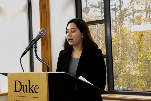 Student delivering mock press conference at podium