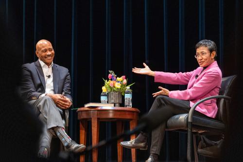 Stephen Buckley and Maria Ressa on stage