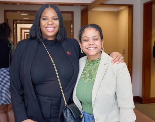 Two women, smiling