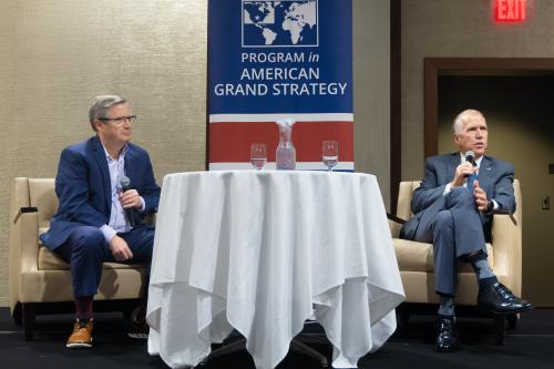 Two men on stage chatting